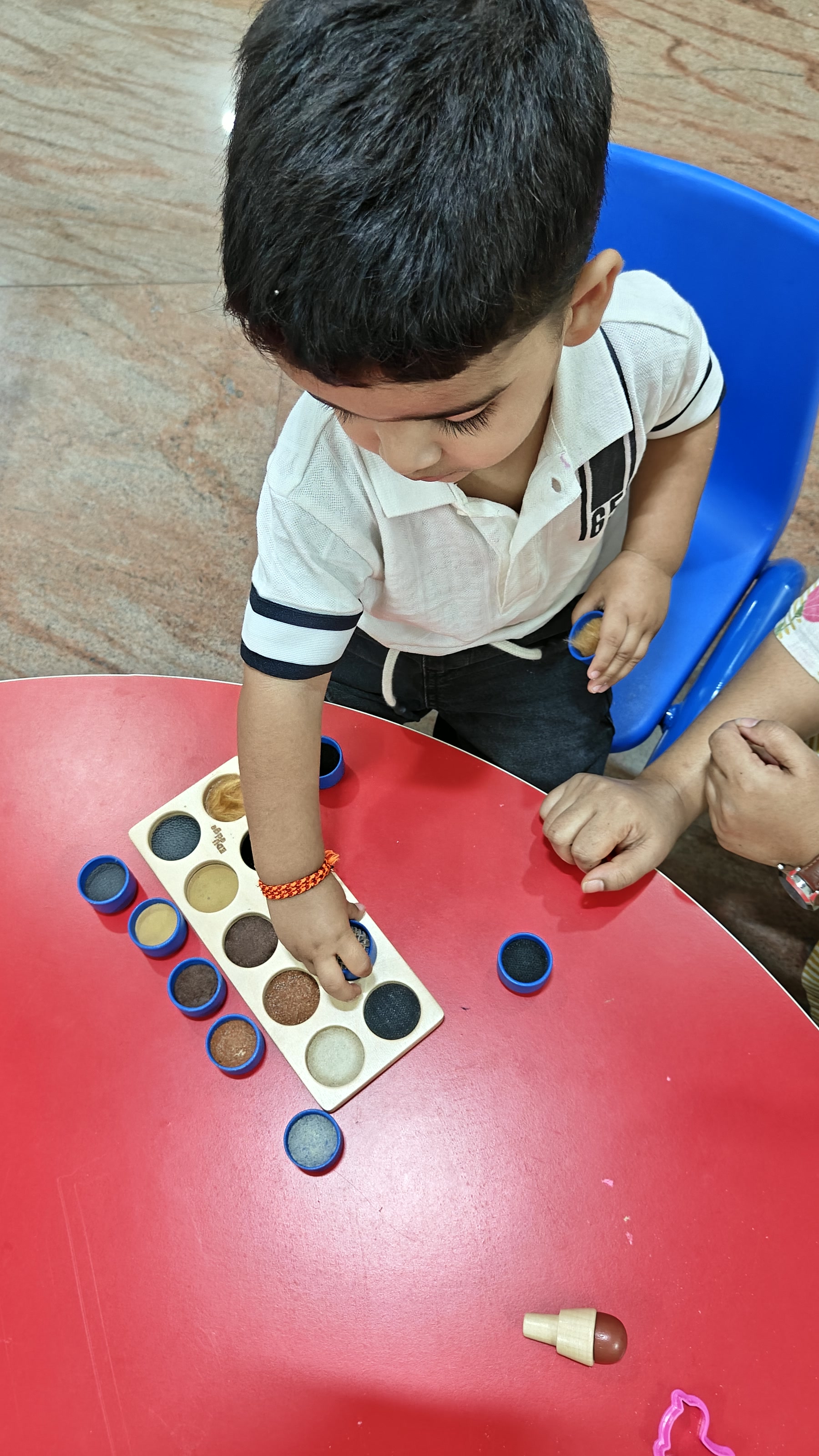 Child focused on a one-to-one matching activity
